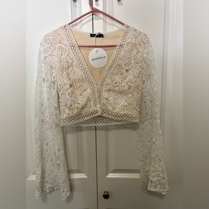 Boohoo bell sleeve white crochet crop top.